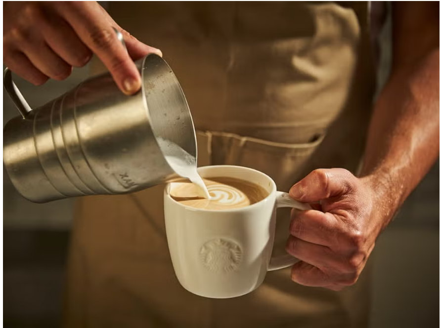 Weproudlyservestarbucks- served-solution-barista-pouring-coffee-